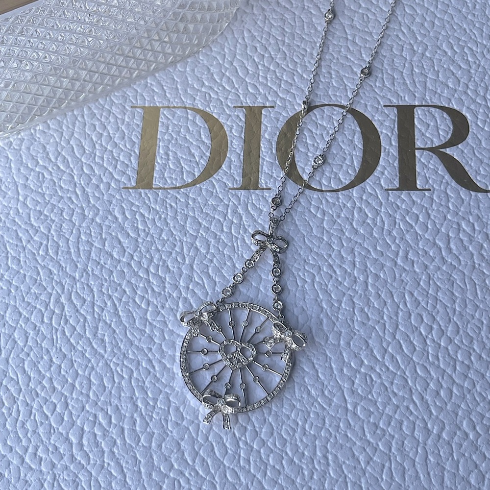 18k White Gold and Real Diamond Peace & Love Bow necklace by Nancy Davis